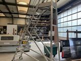 an image of a large industrial building with a ladder