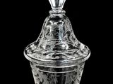 an image of a glass jar with a lid on a black background