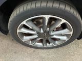 a close up of a tire on a car ' s rim