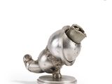 a silver statue of a dog with a hat on it ' s head