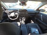 a picture of a car interior with a steering wheel and dashboard