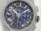 a close up of a wrist watch with a blue strap