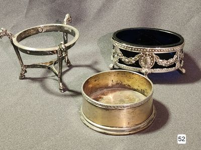 a silver plate and a silver bowl on a table