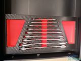 a close up of a set of wrenches in a case