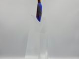 a glass sculpture of a knife on a clear stand