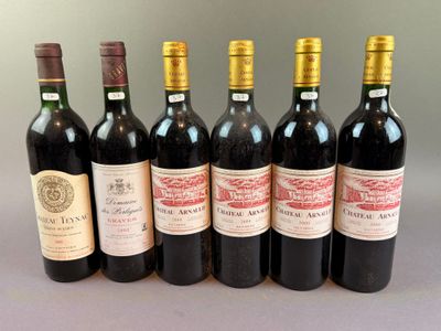 several bottles of wine are lined up on a table