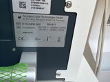 a close up of a machine with a green net on it