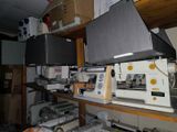 many electronic equipment on a shelf in a room