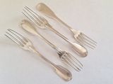 six forks and spoons are arranged in a row on a white surface