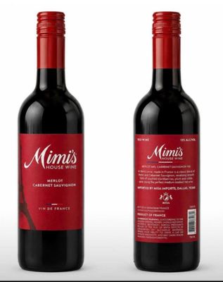 two bottles of wine with a red label on them