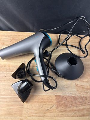 an image of a hair dryer and other items on a table