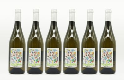 four bottles of wine are lined up on a white surface