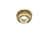 a close up of a ring with a pearl inside of it