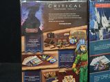 two boxes of legos are sitting on a black surface
