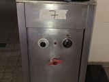 an image of a stainless steel stove with a face on it