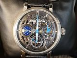 a watch that is sitting on top of a bag