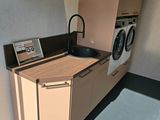a small kitchen with a washer and dryer in it