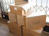 boxes stacked on top of each other in front of a window
