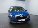 the blue car is parked in the showroom of a dealers showroom