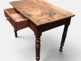 an old wooden table with a drawer on top of it