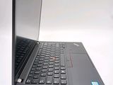 a close up of a laptop computer on a white surface