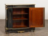 an antique black and gold painted cabinet with open doors