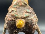 an image of a statue of an elephant with a bird on it ' s back