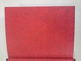 a red box with a pattern on it sitting on a table
