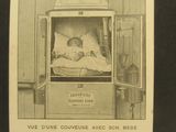 a black and white photo of a baby in a hospital bed