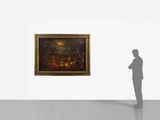 a man that is standing in front of a painting
