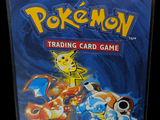 pokemon trading card game in a plastic case on a black background