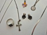 many different types of jewelry displayed on a table