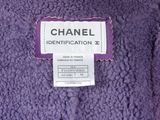 chanel label on a purple jacket with a white background