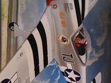 a toy airplane that is flying in the sky