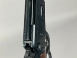 a close up of a rifle with a gun on it ' s side