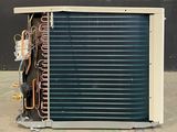 an air conditioner that is sitting on the ground