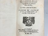 an open book with a black and white image of a bird on top of it