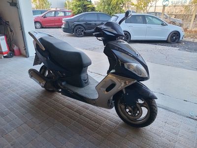 a scooter that is parked in a garage