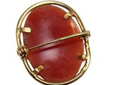 an image of a ring with a red stone inside of it