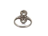 a close up of a diamond ring on a white background