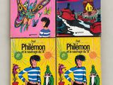 three children ' s books are lined up on a white surface