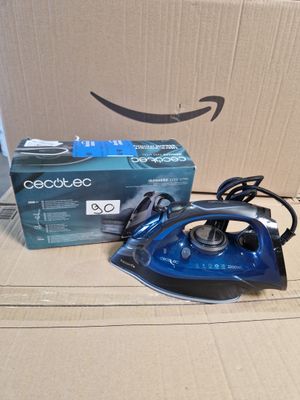 a blue and black iron sitting on top of a cardboard box