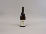 a bottle of wine that is sitting on a table