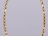 a gold chain necklace on a white background