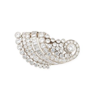 a diamond and white gold broochle