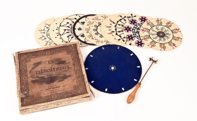 a picture of a book, a clock, and a pair of scissors