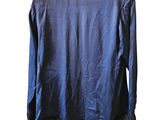 the back of a blue shirt with ruffled hems on a mannequin mannequin mannequin mannequin mannequin mannequin mann