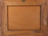 a picture of a wooden picture frame on the wall