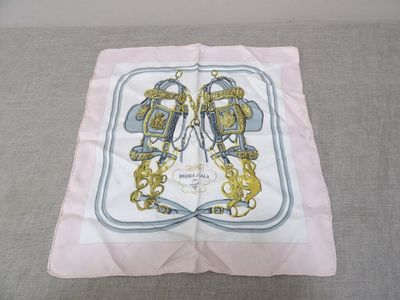 an image of a white and blue square scarf with a gold and blue design
