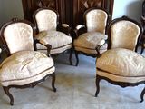 four chairs that are sitting in a room together